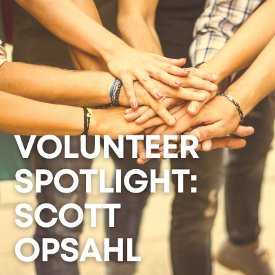 Gold-hued image of many hands together in the center of a huddle with the white text over it that says "Volunteer Spotlight: Scott Opsahl"