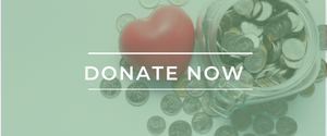 White text that says "Donate Now" on a background of a mint-tinted photo depicting a jar of donations demonstrating the generosity of the community, punctuated by a red heart-shaped object