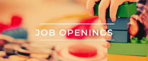 Banner that says "Job Openings," with a background image of a child making connections by stacking big Legos.