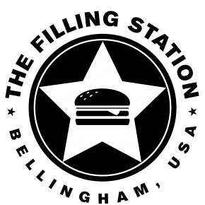 Logo that reads "The Filling Station. Bellingham, USA." The logo is a black-and-white graphic of a burger clip-art within a star, within a circle.