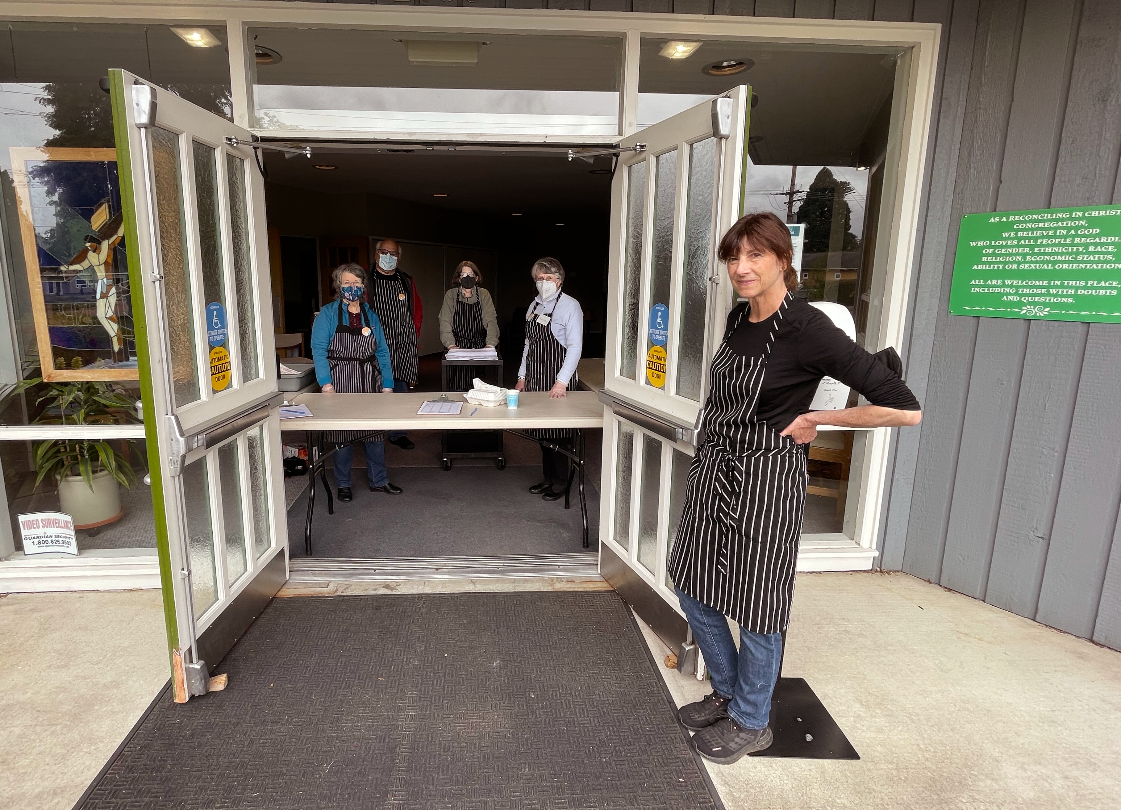 MAI Welcome2022 The doors of Maple Alley in are thrown wide open with 5 people smiling at the camera, ready to welcome diners