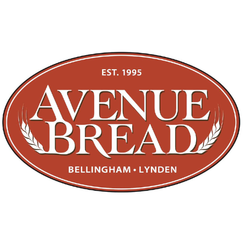 Brick-colored oval with Avenue Bread heading turning into wheat stalk graphics, with small text saying "Established 1995" and "Bellingham & Lynden".