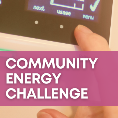 A hand programs a home thermostat. A magenta banner reads "Community Energy Challenge."