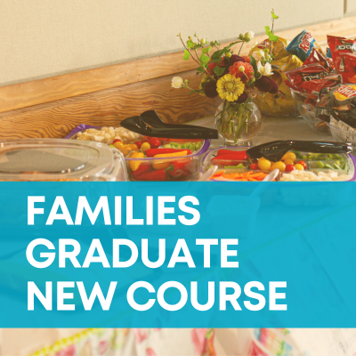 A gold-tinged background shows a buffet table with fruit, vegetables, chips, sandwiches, and other food. A teal graphic banner is overlaid with white text saying "Families graduate new course."