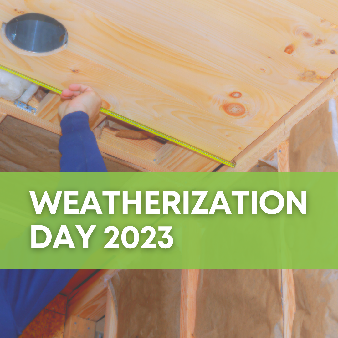 A background photo depicts a worker using a tape measure to measure a piece of plywood in an attic. A lime-green banner in the foreground has white text that says "Weatherization Day 2023."