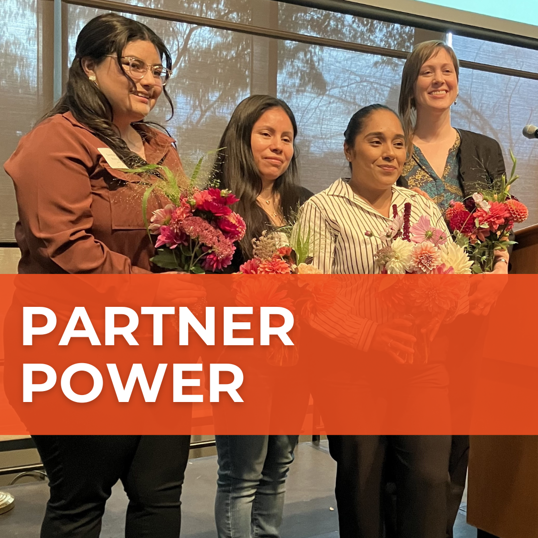Four people hold vibrant bouquets of flowers in a photo. Over it, a red banner says "Partner Power."