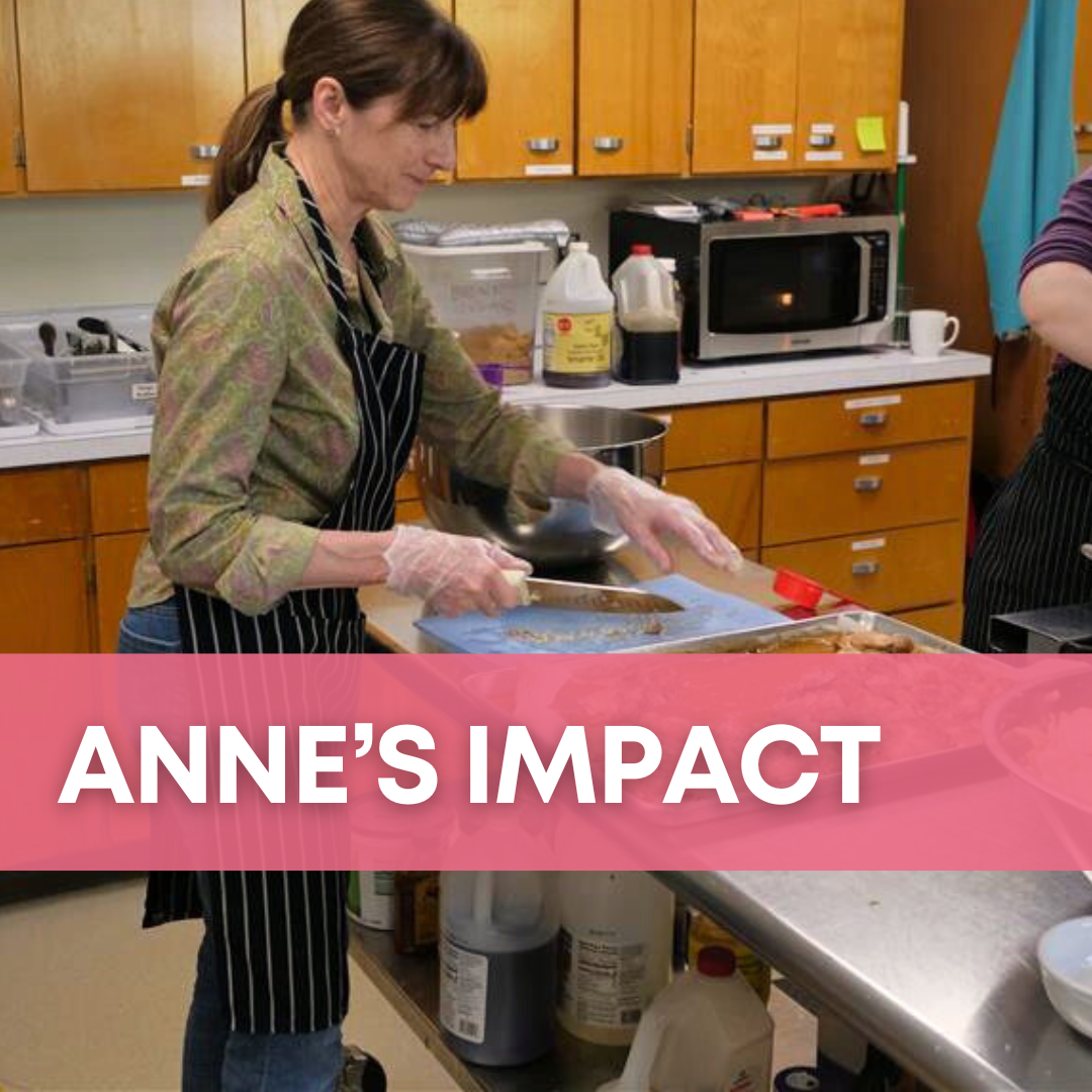 A woman cuts food at a cutting board on a kitchen prep table, with the heading "Anne's Impact."