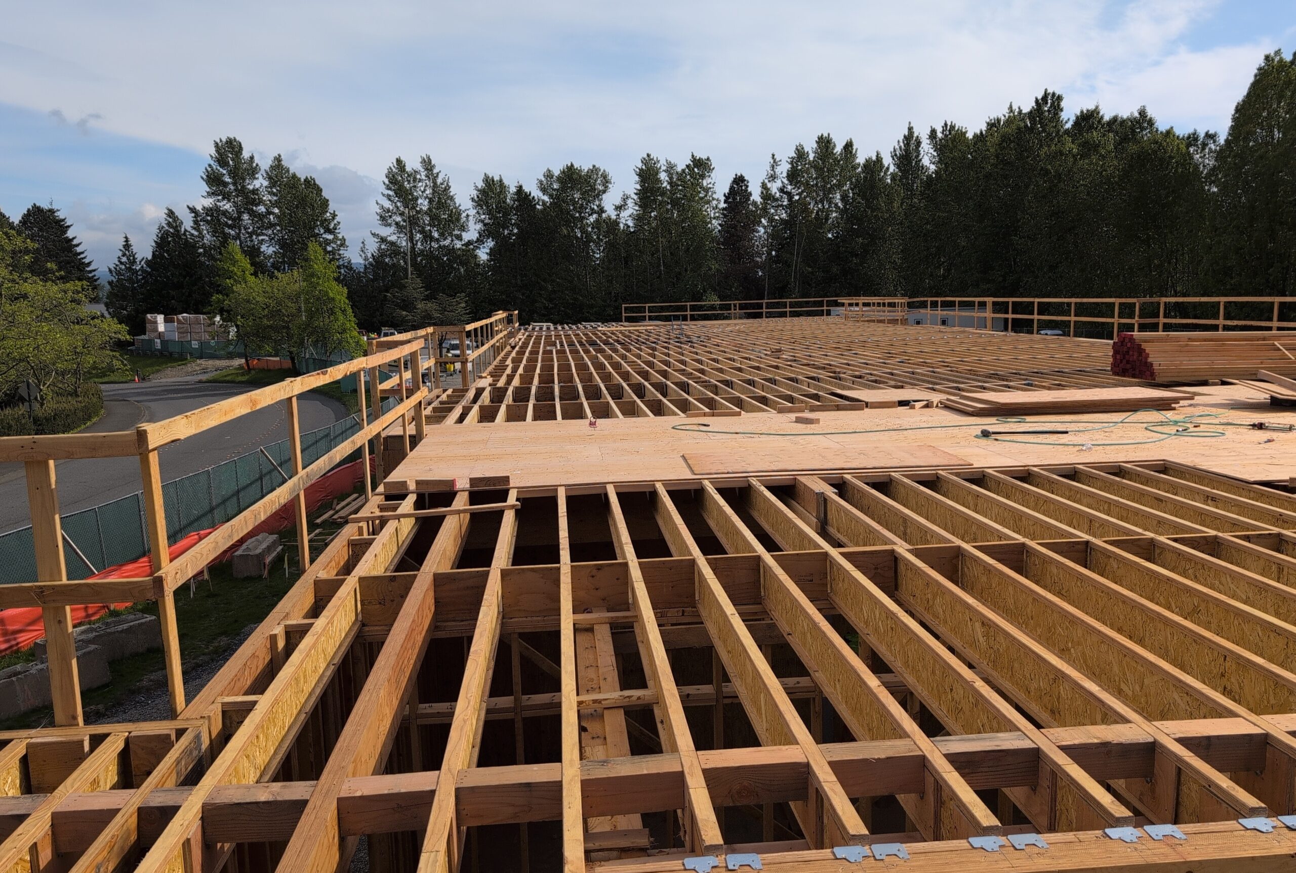 Photo of wood framing of a building being built.