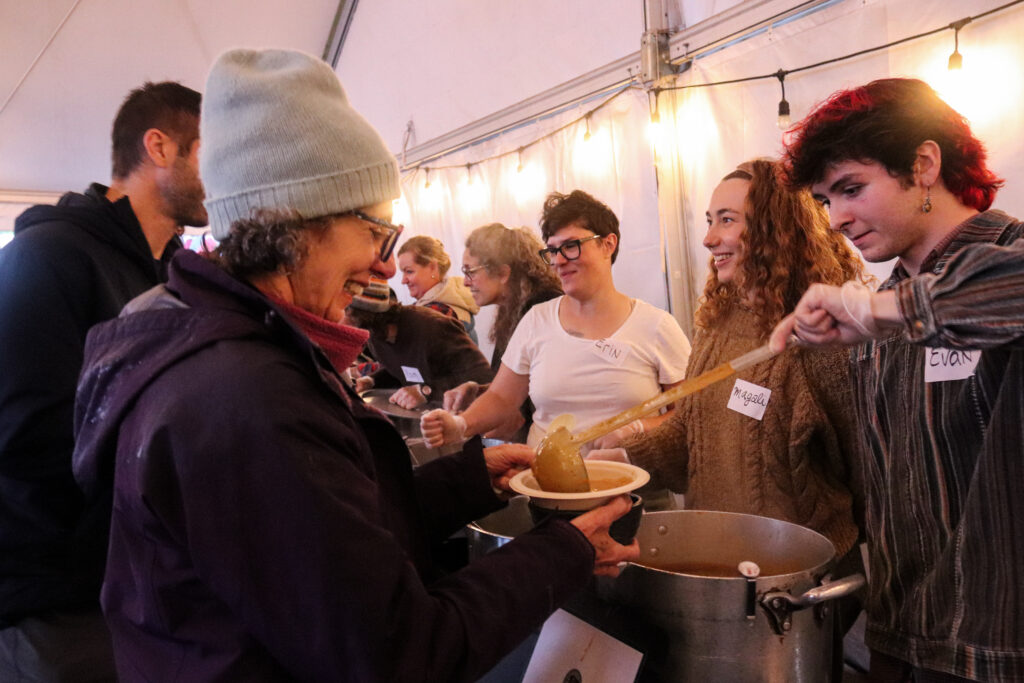 People are served soup.